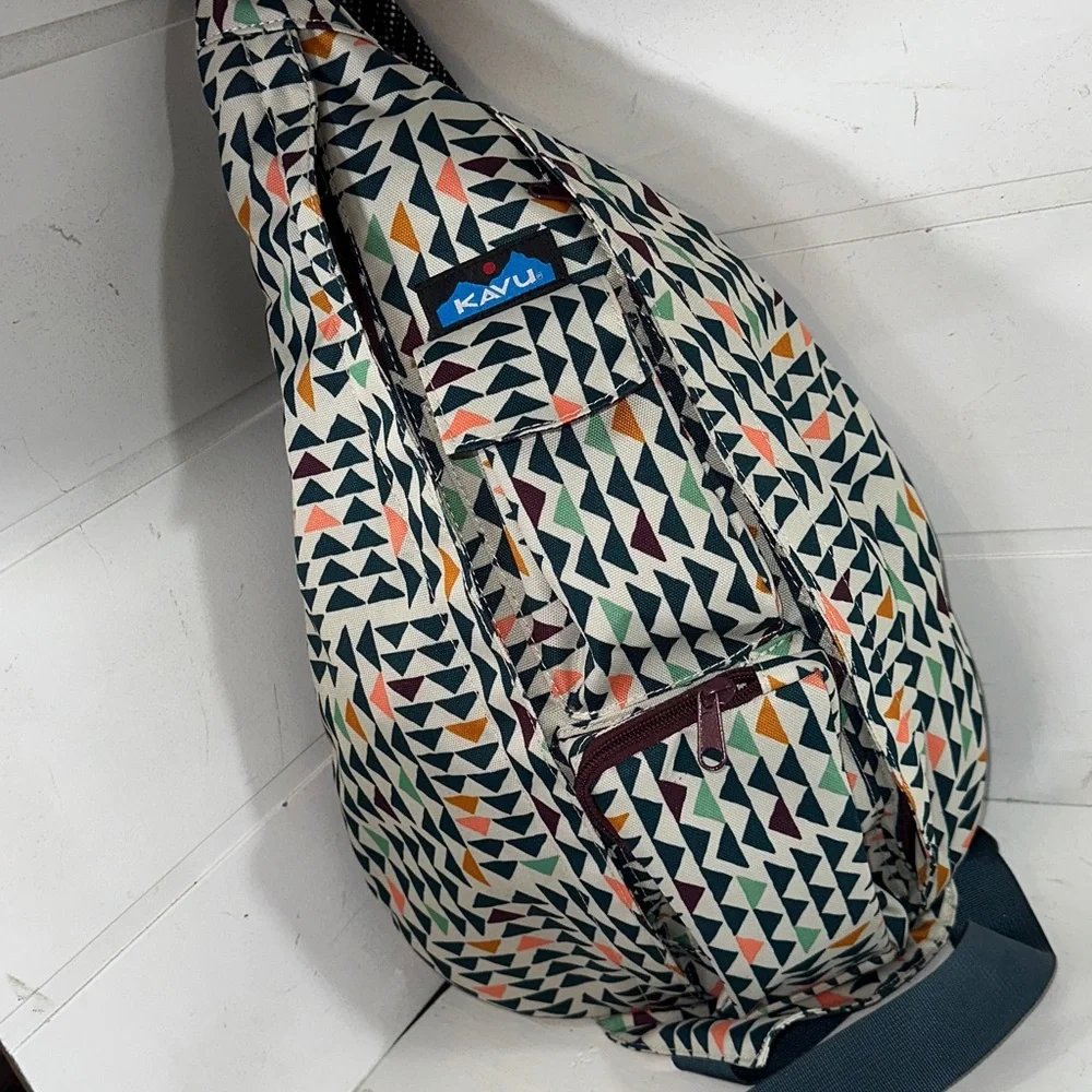 Kavu Geometric Triangle Sling Backpack in Cream, Black, Orange, Green, Navy